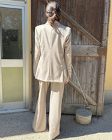 Blazer doppiopetto garcon flanella gessata viewed from the back, showcasing a stylish light sand color.